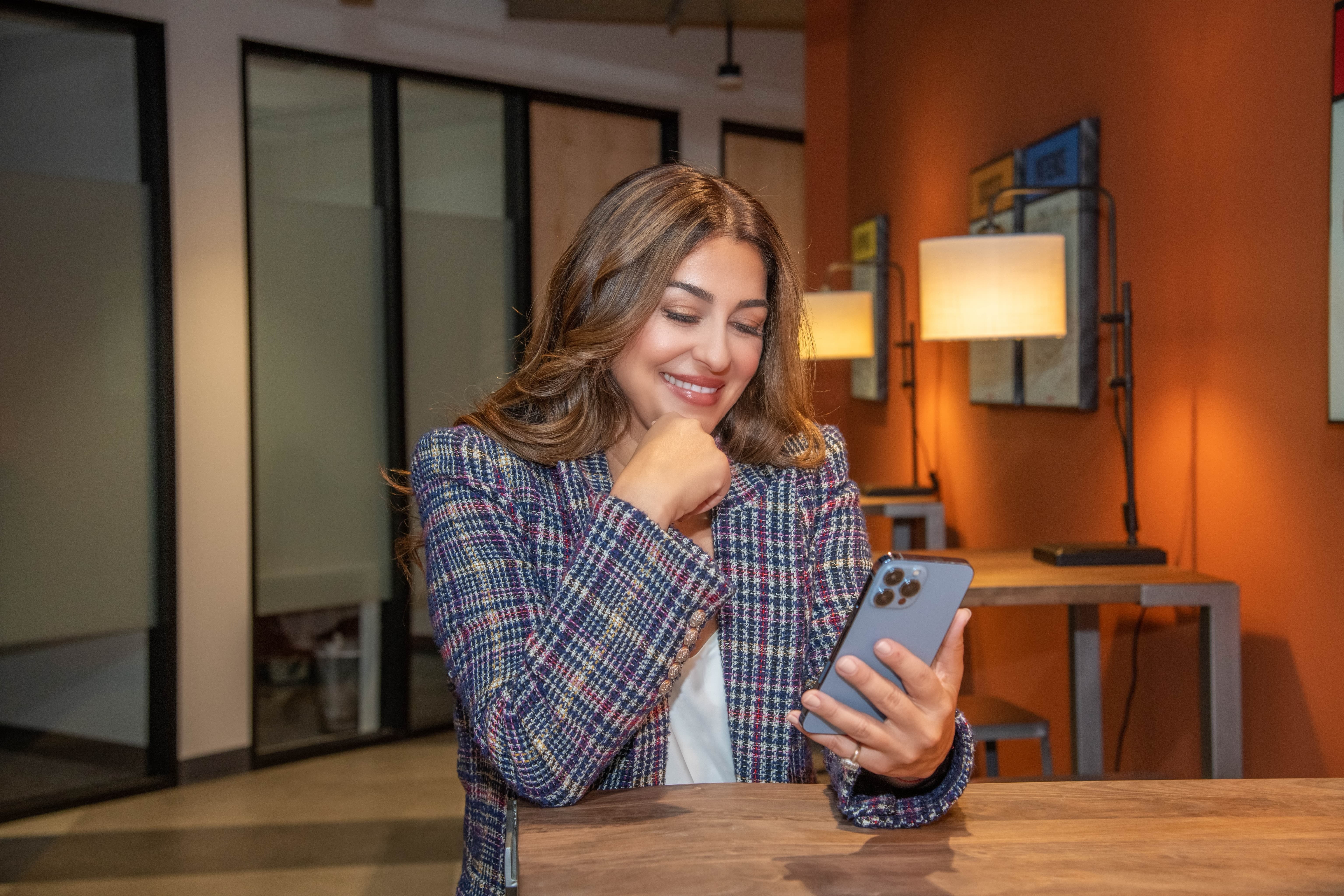 M.Y Looking at phone